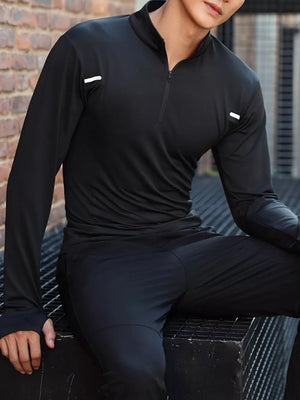 Men's black long sleeve quarter-zip active t-shirt with reflective shoulder details.