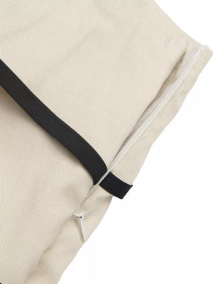 Cream maternity romper with black trim and side zipper detail