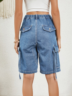 Denim Bermuda shorts in medium wash with cargo pockets and buttoned back pockets.
