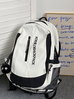 Large white and black nylon backpack with zippered pocket and fuzzy charm