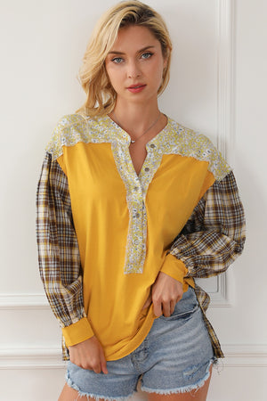 Yellow mixed media blouse with floral yoke and plaid sleeves, button front henley style.