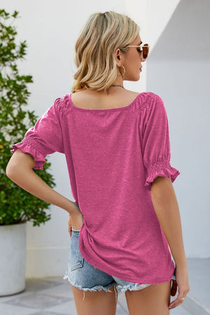 Gathered square neck puff sleeve top in cerise with ruffled cuffs.