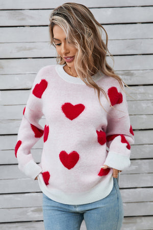 Crewneck sweater in light pink with red heart appliqué, long sleeves, crew neck, casual style