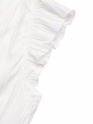 White maternity blouse with textured fabric and ruffled cap sleeves.