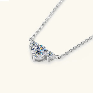Silver necklace with three sparkling diamonds in a graduated design.