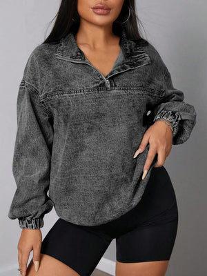 Chic quarter-zip denim sweatshirt in dark gray acid wash with elastic hem.