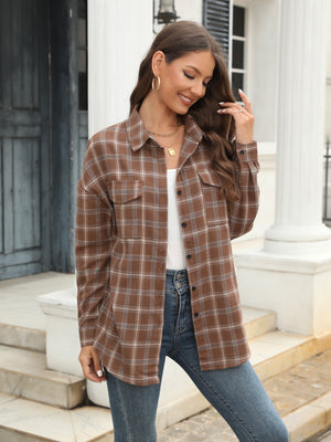 Brown plaid button-up shirt with two chest pockets and a collared neckline.