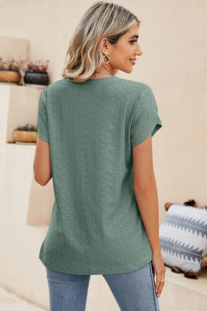 Light Green eyelet sleeve detail V-neck top with short sleeves and a textured pattern.