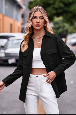Black oversized utility shirt with two chest pockets and a collared neckline.