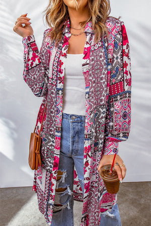 Patchwork print duster shirt jacket with button front and long sleeves, styled with jeans.