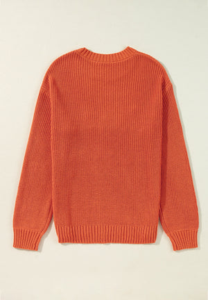 Orange acrylic knit sweater with crew neck and long sleeves.