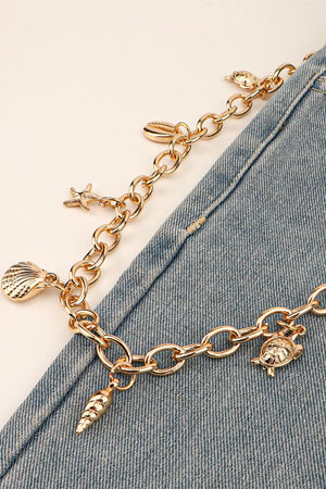 Gold chain belt with seashell, starfish, turtle, and cone charms.