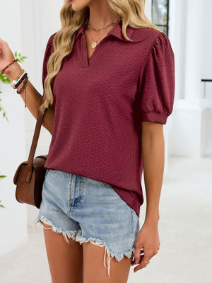 Wine red eyelet collar top with puff sleeves and a textured pattern.