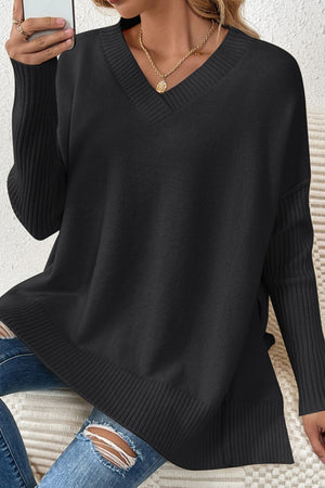 Black v-neck knit sweater with asymmetric hemline and ribbed sleeves.
