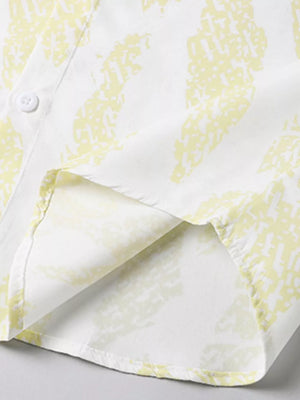 Cotton button-up shirt in Neon Yellow abstract pattern, showing hem detail.