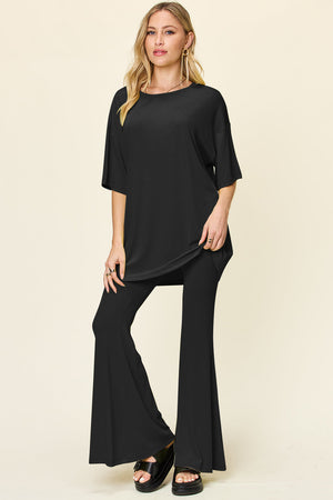 Black oversized tee and flare leg pants set with round neckline and short sleeves.