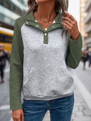 Quilted raglan henley sweatshirt in moss green and gray with button detail and front pocket.
