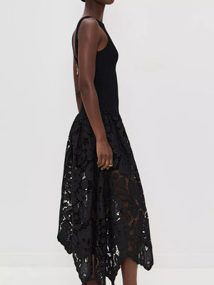 Black midi dress with crochet cutout detail and asymmetrical hem