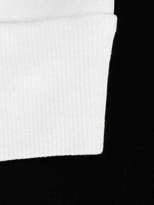 White ribbed fabric detail of a casual zip-up hoodie.