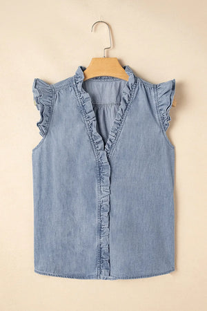 Chambray ruffle trim sleeveless blouse in medium blue cotton with V-neck and button front.