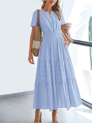 Light blue V-neck tiered maxi dress with smocked waist and short sleeves.