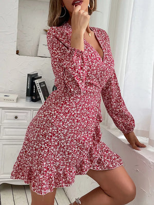 Red floral wrap mini dress with V-neck, long sleeves, and ruffled hem.