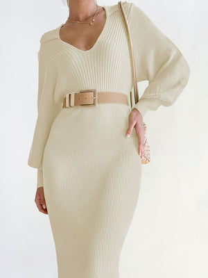 Cream ribbed knit midi dress with V-neck and long sleeves, cinched with a belt.