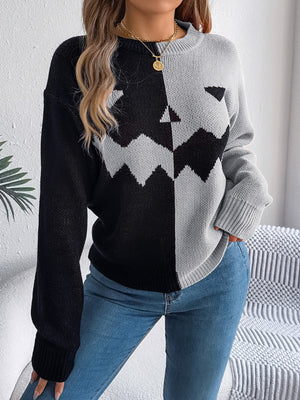 Split-Face Pumpkin Knit Sweater in black and gray acrylic with a crew neck.