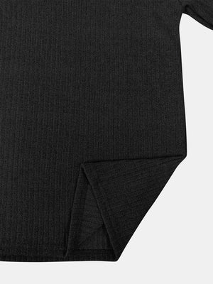 Black ribbed knit quarter-zip pullover sweater with side slit detail.