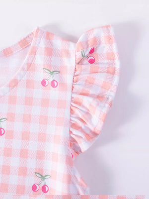 Baby dress with pink gingham, cherry embroidery, and ruffle sleeves.