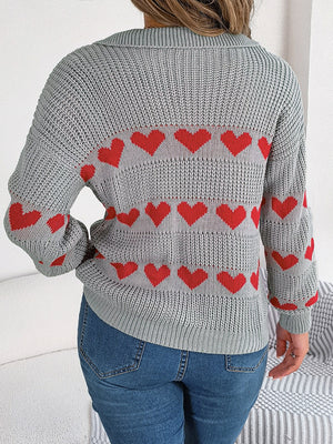 Gray knit polo sweater with red heart stripe pattern and long sleeves.