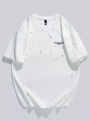White cotton t-shirt with black and red paint splatter detail and graphic text.