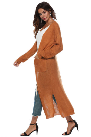 Longline knit cardigan in Caramel with side slits and pockets.