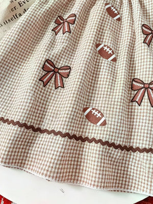 Children's Gingham Football Puff Sleeve Dress in Brown, model styling view