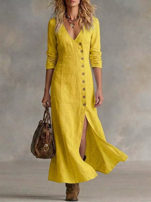 Yellow V-neck button maxi dress with a side slit and long sleeves.