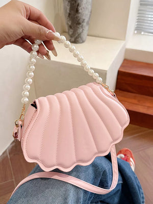 Pink shell crossbody bag with pearl strap detail