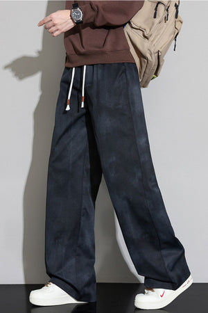 Black relaxed fit sweatpants with cloud pattern and white drawstring.