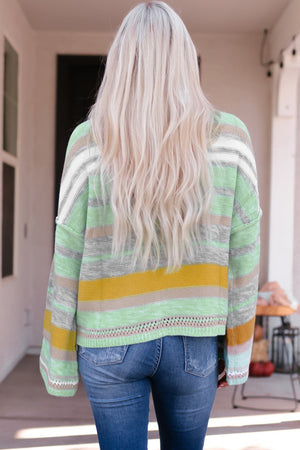 Open-shoulder stripe knit pullover in gum leaf with boatneck and casual fit.