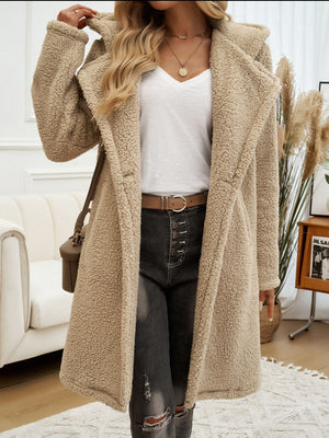 Camel teddy hooded cocoon coat with a relaxed fit and plush texture.