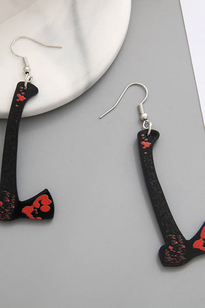Black drop earrings shaped like gory blades with red accents.