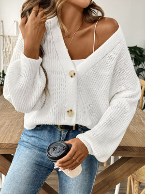 White balloon sleeve button-down knit cardigan with two buttons and a V-neck.