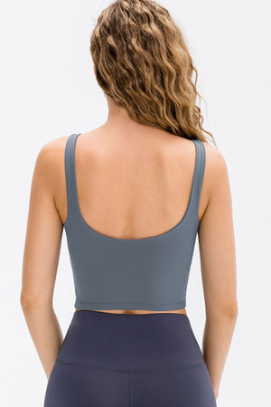 Performance scoop crop top in Cloudy Blue with a racerback detail.