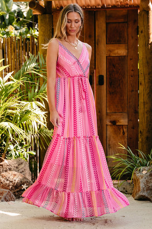 Pink chevron stripe tiered maxi dress with V-neck and tie waist.