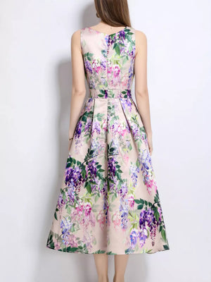 Blush pink a-line midi dress with wisteria floral print, sleeveless, and pleated skirt.