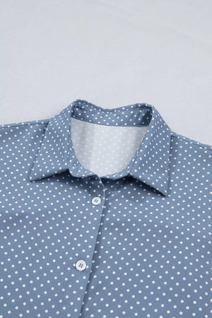 Blue polka dot polyester shirt with button front and collar detail.