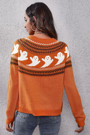 Orange crewneck sweater with white ghost pattern and fair isle detail