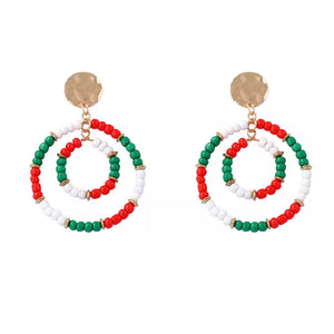 Festive beaded hoop earrings in red, white, and green with gold accents.