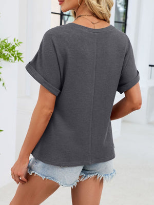 Gray waffle knit t-shirt with cuffed short sleeves and a relaxed fit.