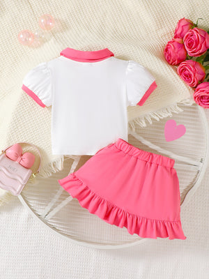 White short sleeve polo top with pink trim and bright pink ruffle skirt set for baby girls.