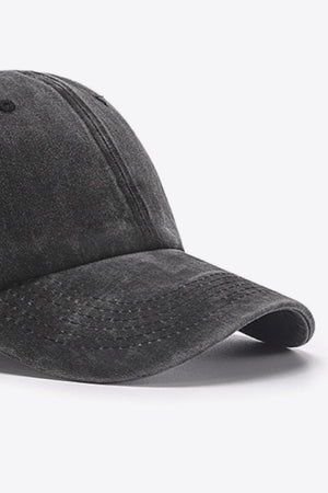 Washed cotton baseball cap in black with a curved brim and stitched details.